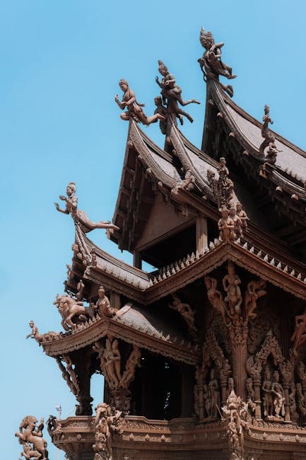 Intricate wooden carvings adorn the Sanctuary of Truth temple in Pattaya, Thailand.
